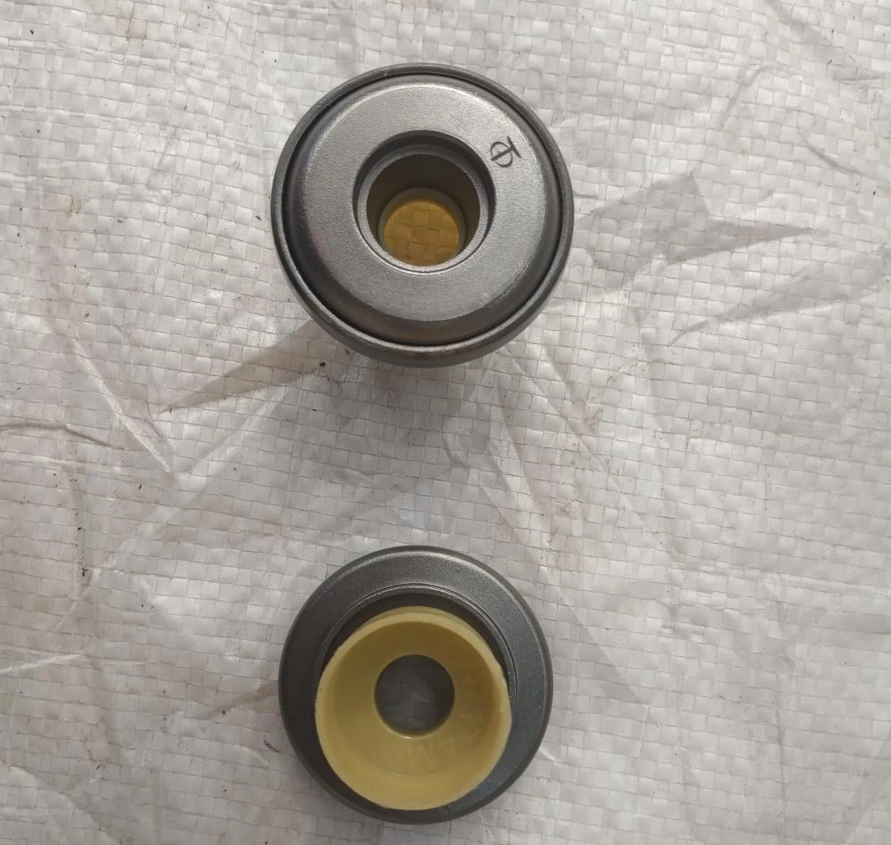 Rotating spring seat and oil cover components 